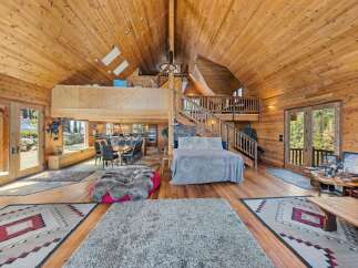 Step into luxury with this stunning cabin featuring a grand, open-concept design.