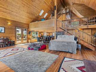Step into rustic luxury in this stunning cabin-style home.