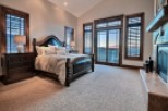 Luxurious mountain retreat boasting a spacious master suite with stunning views.
