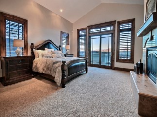 Luxurious mountain retreat boasting a spacious master suite with stunning views.