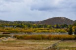 Picturesque property with mountain views and fall foliage.