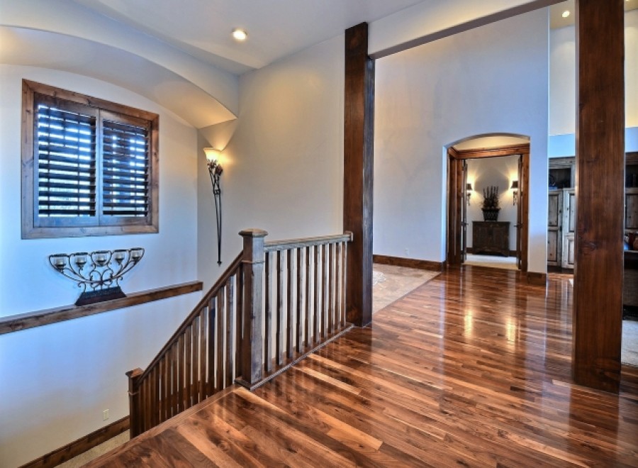 This stunning home boasts gleaming hardwood floors that flow seamlessly throughout the main living areas.