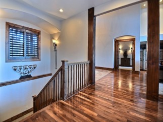 This stunning home boasts gleaming hardwood floors that flow seamlessly throughout the main living areas.