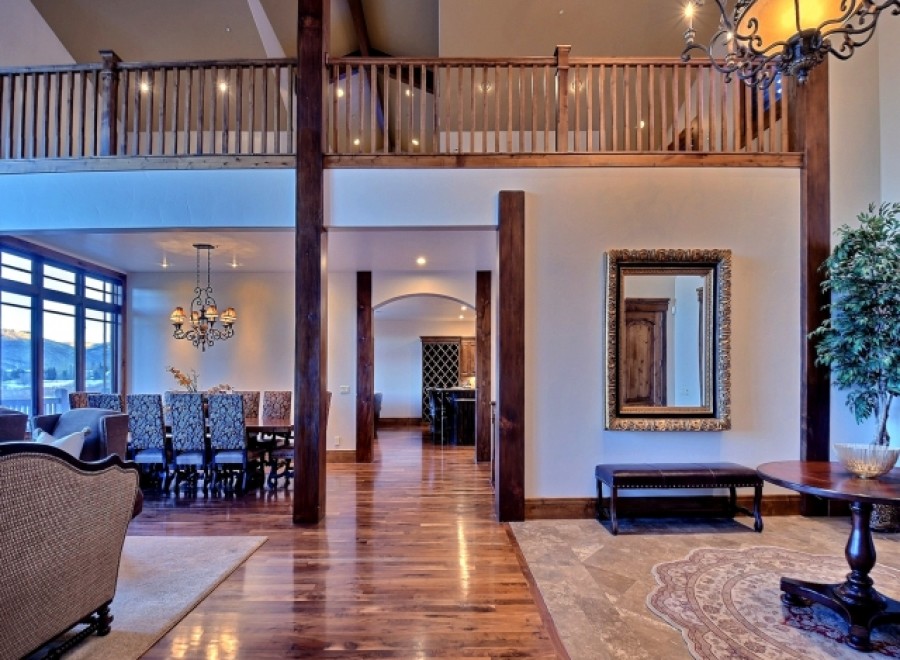 This stunning home boasts a spacious open floor plan with hardwood floors, a grand dining area, and a luxurious living space.