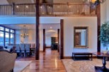 This stunning home boasts a spacious open floor plan with hardwood floors, a grand dining area, and a luxurious living space.