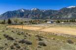 Discover the beauty of this stunning property nestled against a backdrop of majestic mountains.