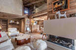 Experience luxury living in this stunning chalet, featuring exquisite wooden interiors and a cozy fireplace.