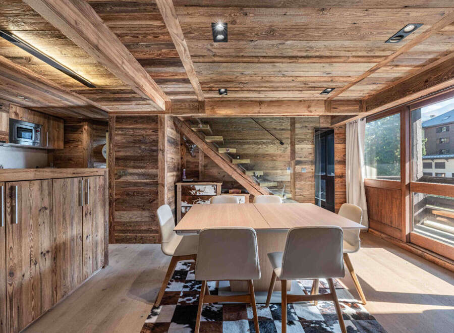 Experience rustic elegance in this stunning chalet-style dining area.