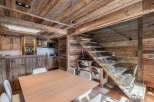 Experience rustic elegance in this stunning property, featuring exquisite wooden interiors and a modern glass staircase.