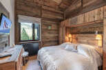 Experience rustic elegance in this stunning bedroom.