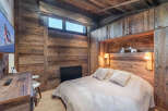 Experience rustic luxury in this stunning bedroom.