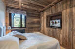 Experience rustic luxury in this stunning bedroom.