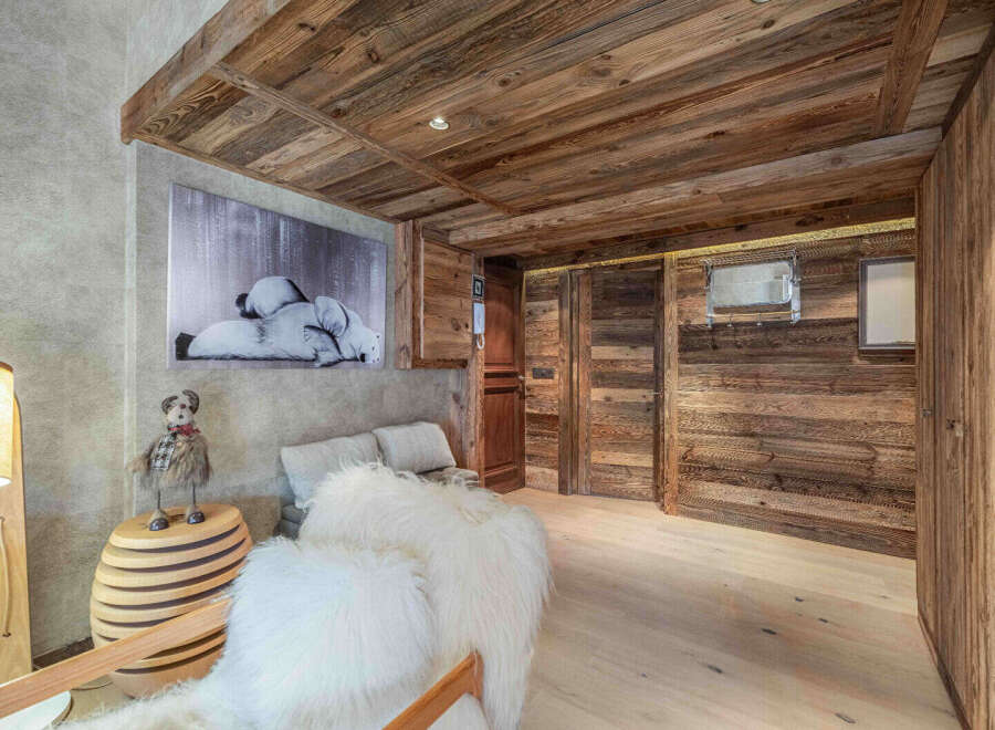 This stunning property boasts a rustic charm with its wooden ceiling and walls, creating a warm and inviting atmosphere.