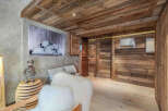 This stunning property boasts a rustic charm with its wooden ceiling and walls, creating a warm and inviting atmosphere.