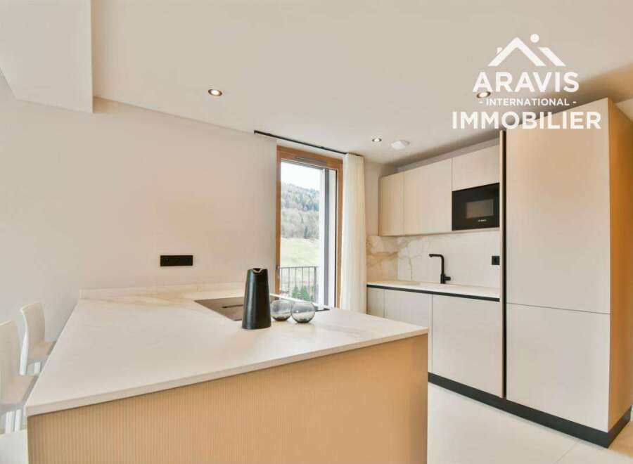 Discover modern living in this stunning kitchen! Featuring sleek countertops, contemporary cabinetry, and a built-in microwave, this space is perfect for culinary enthusiasts.
