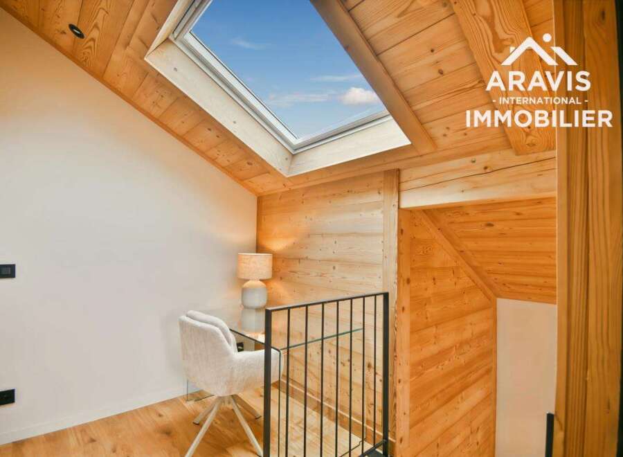 Discover the charm of this stunning property, featuring a unique design with wooden accents and a skylight that floods the space with natural light.