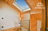 Discover the charm of this stunning property, featuring a unique design with wooden accents and a skylight that floods the space with natural light.