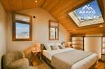 Discover the charm of this stunning property, featuring a cozy bedroom with a comfortable bed and stylish decor.