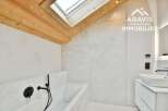 This modern bathroom boasts a sleek design with clean lines and a bright, airy feel.