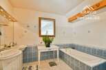 Discover this charming bathroom featuring a bright and airy design.