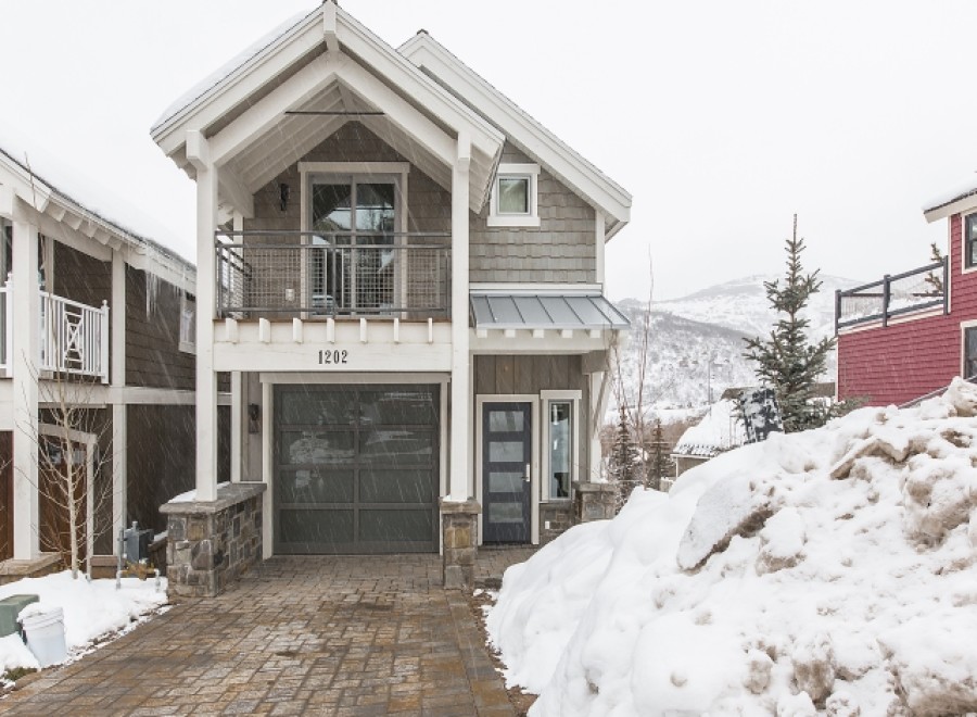 This charming 2-story townhome boasts a spacious garage, private balcony, and modern interior.