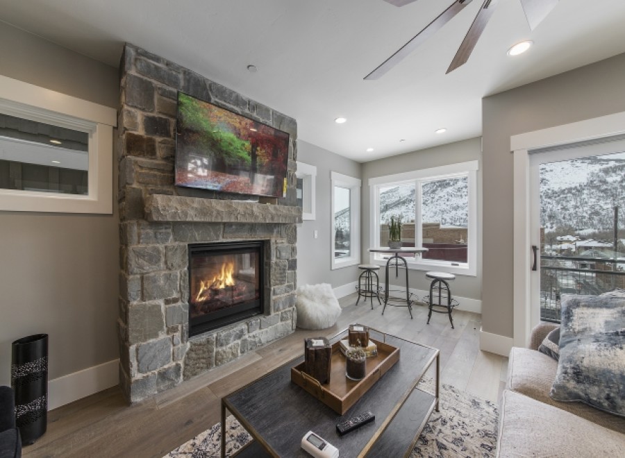 This stunning property boasts a cozy stone fireplace, perfect for relaxing winter evenings.