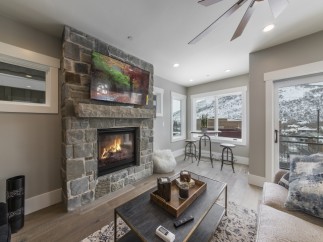 This stunning property boasts a cozy stone fireplace, perfect for relaxing winter evenings.