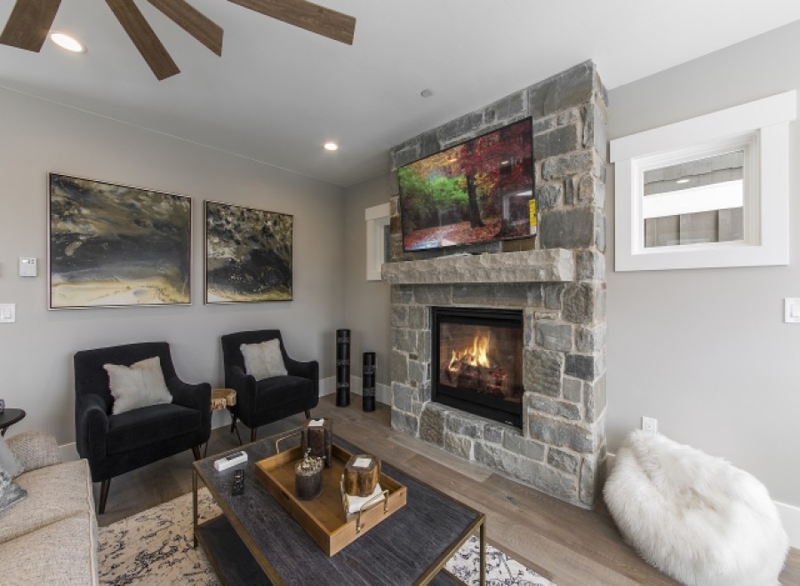 This stunning living room boasts a cozy fireplace, perfect for relaxing evenings.