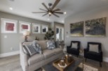 This stunning living room boasts a spacious and open floor plan, perfect for entertaining.