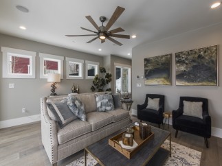This stunning living room boasts a spacious and open floor plan, perfect for entertaining.