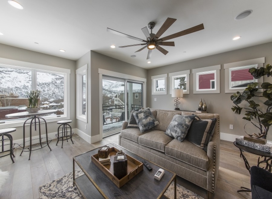 This stunning property boasts an open floor plan with floor-to-ceiling windows offering breathtaking mountain views.