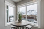Cozy corner breakfast nook with stunning mountain views.