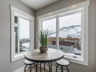 Cozy corner breakfast nook with stunning mountain views.