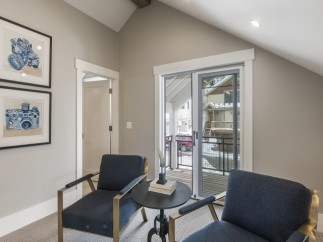 This stunning property boasts a bright and airy interior with large windows offering breathtaking views.