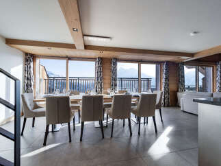 Experience luxury living with this stunning property featuring a spacious dining area.