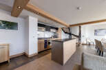 This stunning kitchen boasts a modern design with high-end appliances and ample counter space.