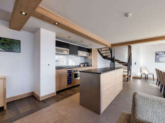 This stunning kitchen boasts a modern design with high-end appliances and ample counter space.