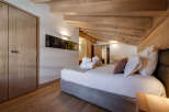 Experience the epitome of rustic elegance in this stunning bedroom.