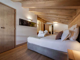 Experience the epitome of rustic elegance in this stunning bedroom.