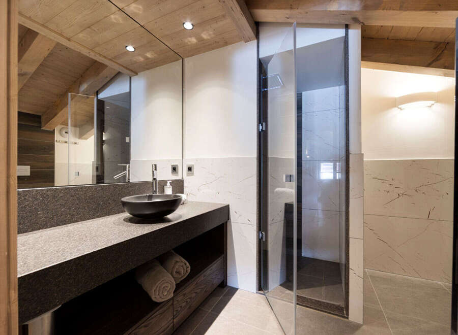 Experience luxury in this stunning bathroom featuring a sleek, modern design.