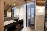 Experience luxury in this stunning bathroom featuring a sleek, modern design.