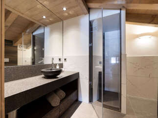 Experience luxury in this stunning bathroom featuring a sleek, modern design.