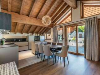 This stunning property boasts a modern kitchen with sleek cabinetry and a spacious layout, perfect for culinary enthusiasts.