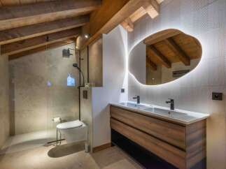 This stunning bathroom boasts a modern design with rustic elements.