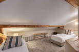 This charming bedroom features a cozy and inviting atmosphere, perfect for a relaxing retreat.