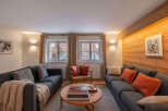 Experience cozy mountain living in this charming living room, featuring two comfortable sofas perfect for relaxation.