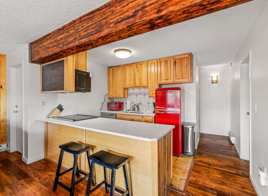 This charming kitchen boasts a modern design with a touch of vintage flair.