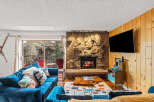 Experience the warmth of this inviting living space, featuring a cozy fireplace and a stylish entertainment area.