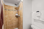 Step into a beautifully designed bathroom featuring a stylish shower with elegant tile work.