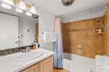 This bathroom features a clean and modern design with a white countertop and a stylish sink.